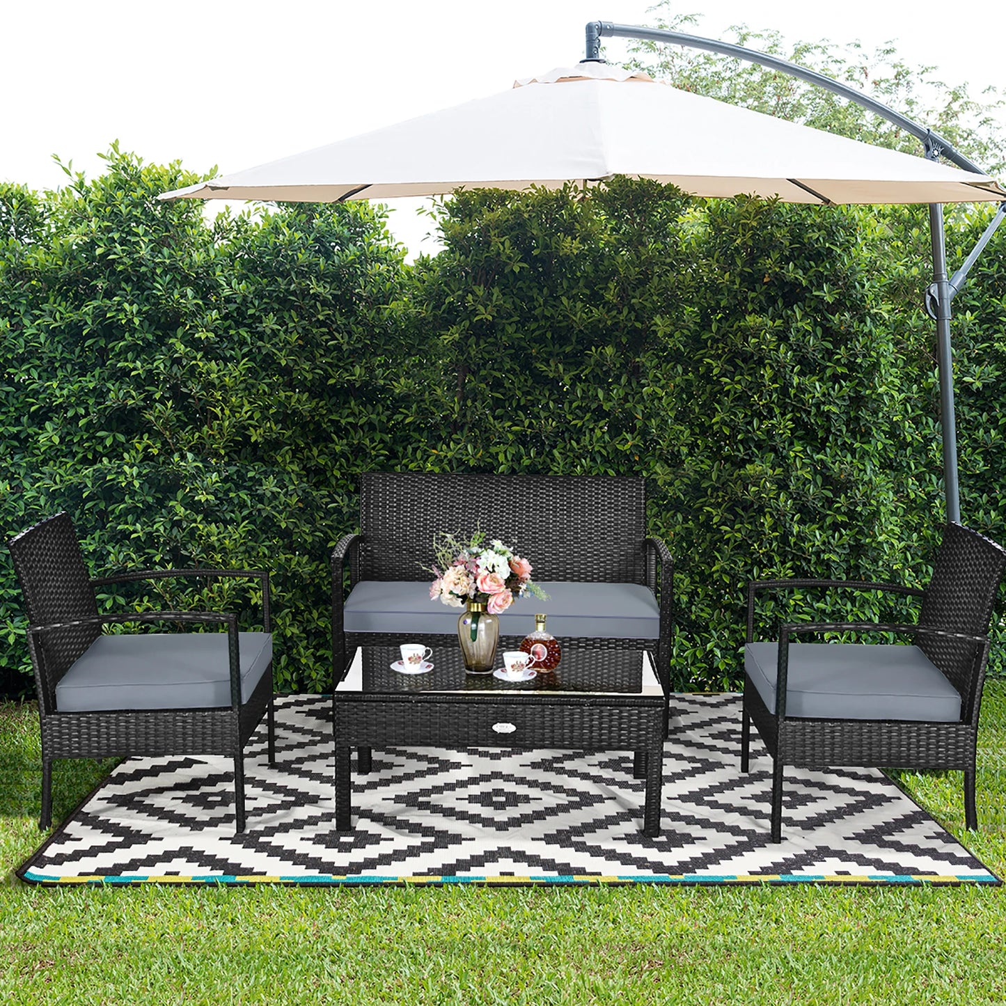 HOMASIS 4-Piece Outdoor Patio Rattan Wicker Set Cushioned Chairs Table